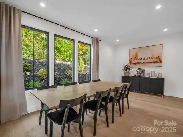 a dining room with furniture and window