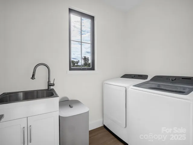 a spacious bedroom with a large bed and a large window