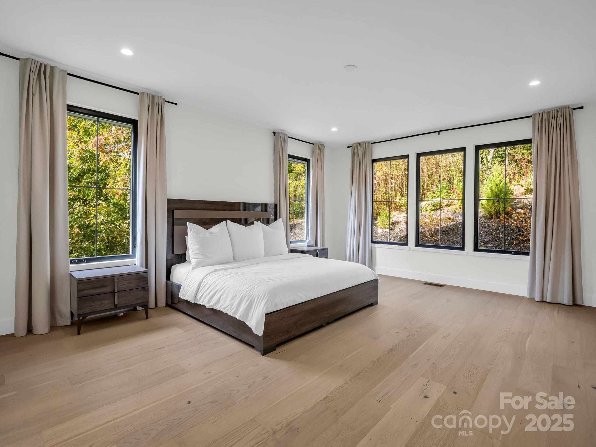 123 Millbrae Loop Hendersonville, NC 28791 - Photo 28 of 48 a spacious bedroom with a large bed and a large window