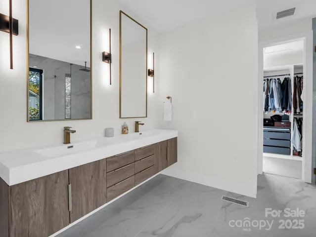 a bathroom with a tub and a window