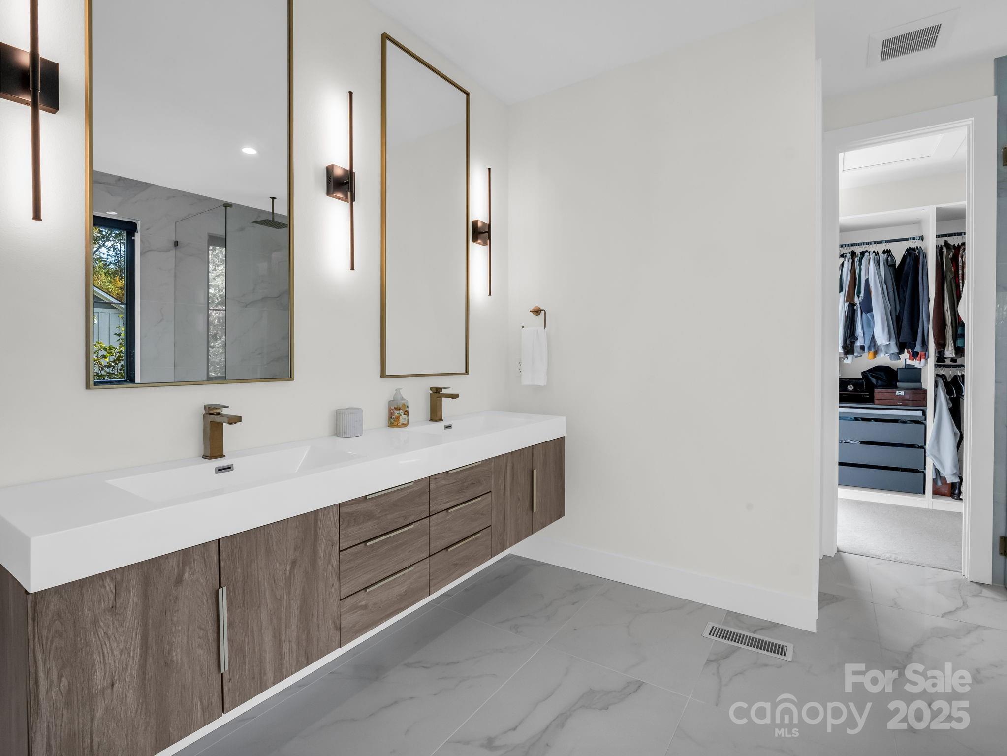 123 Millbrae Loop Hendersonville, NC 28791 - Photo 30 of 48 a bathroom with a double vanity sink and mirror