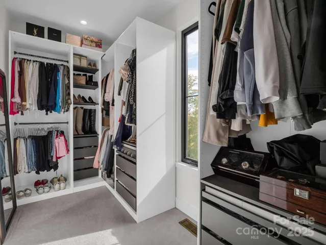 a view of hallway with wooden floor