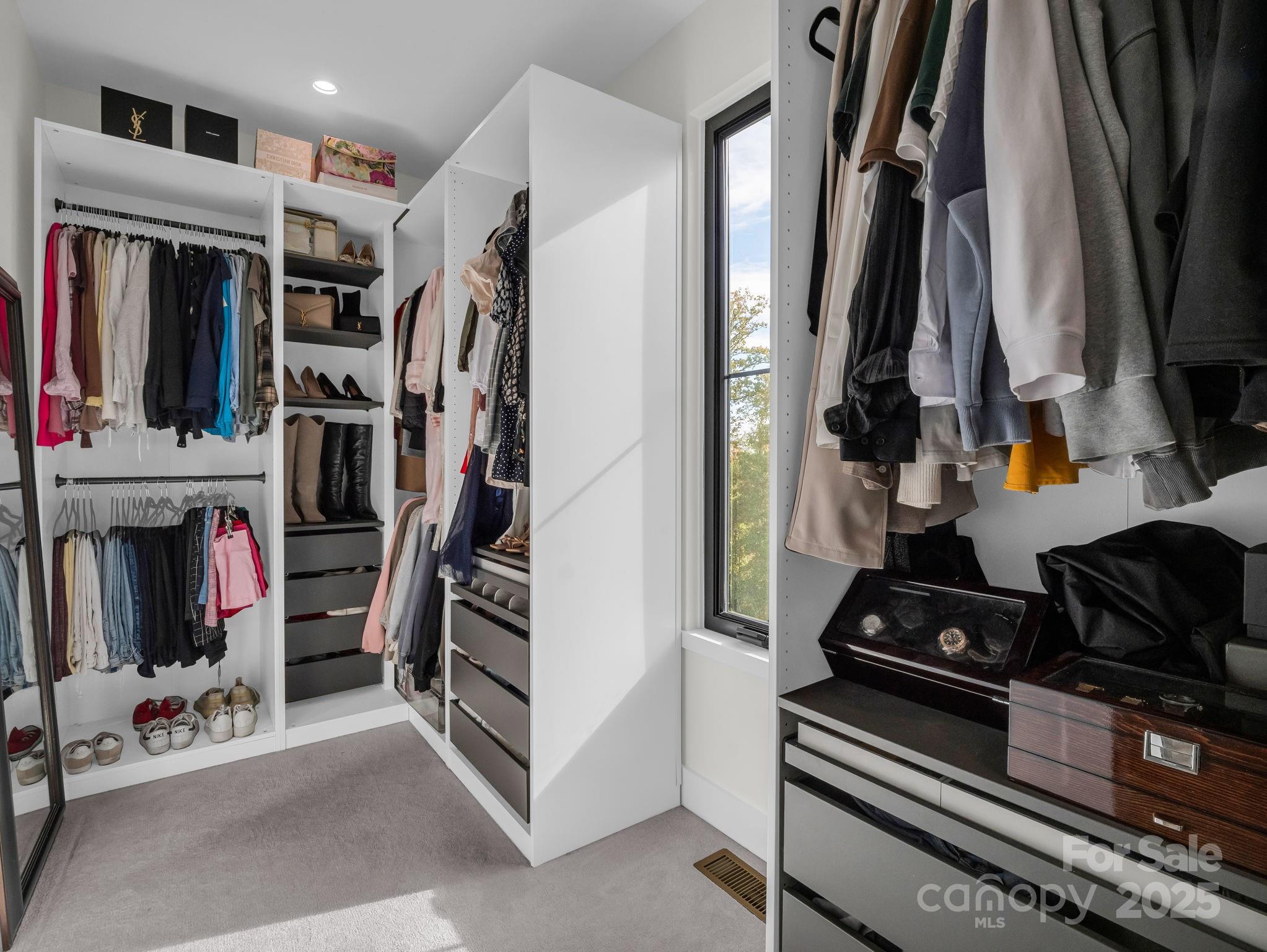 123 Millbrae Loop Hendersonville, NC 28791 - Photo 32 of 48 a view of walk in closet with clothes and shoes