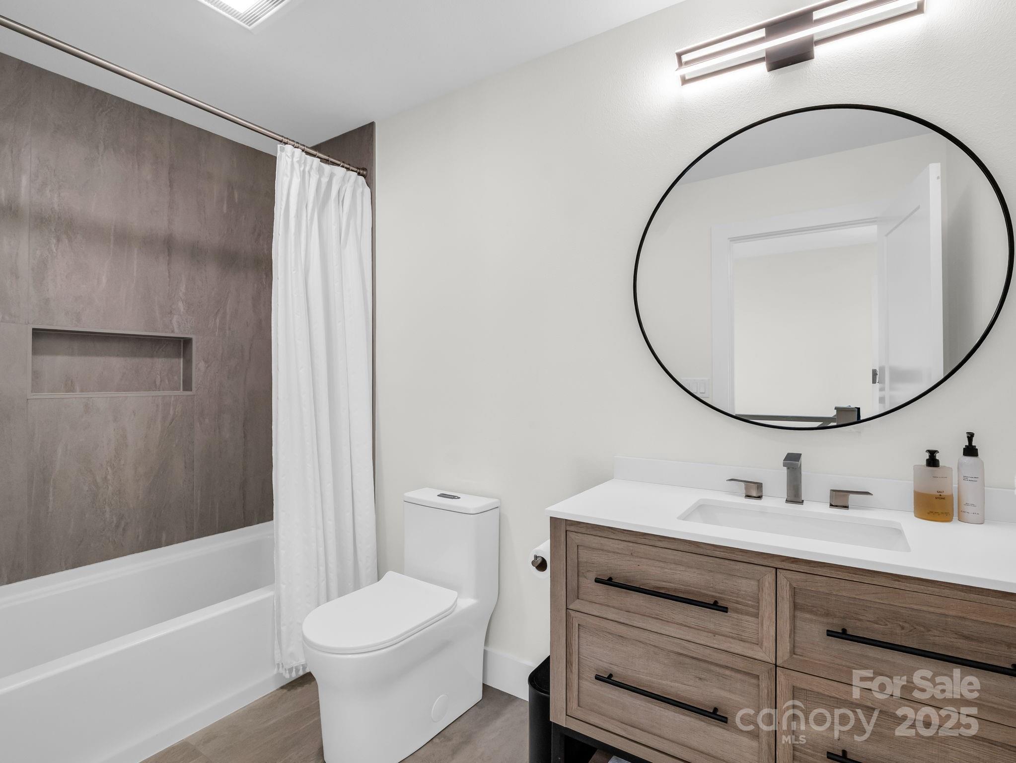 123 Millbrae Loop Hendersonville, NC 28791 - Photo 40 of 48 a bathroom with a sink toilet and shower