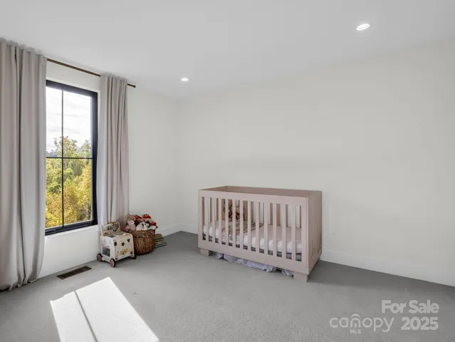 a view of a bedroom with furniture and staircase