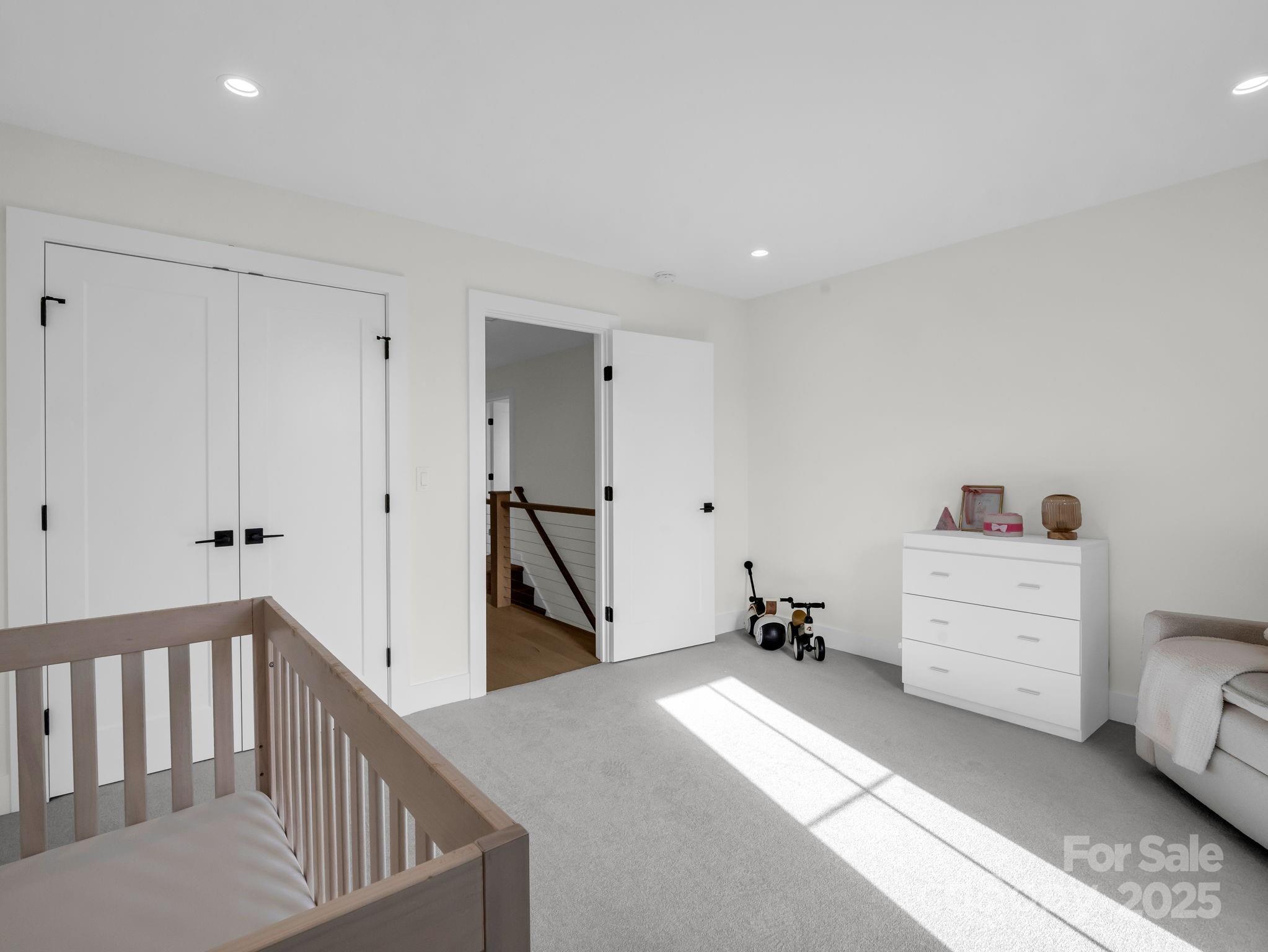 123 Millbrae Loop Hendersonville, NC 28791 - Photo 42 of 48 a view of a bedroom with furniture and staircase
