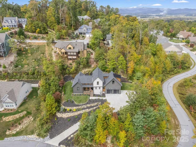 an aerial view of residential house with outdoor space