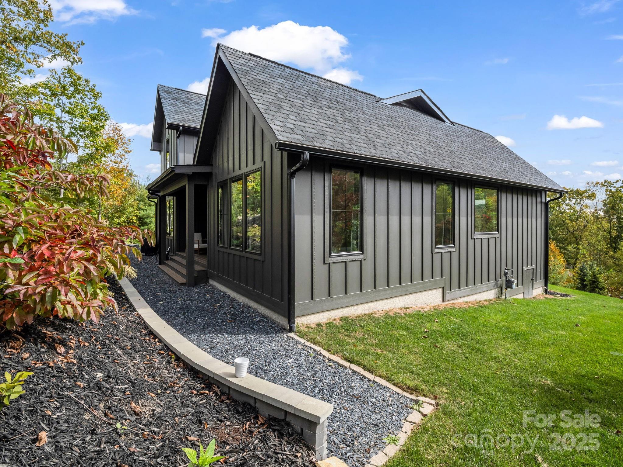 123 Millbrae Loop Hendersonville, NC 28791 - Photo 6 of 48 a front view of a house with garden