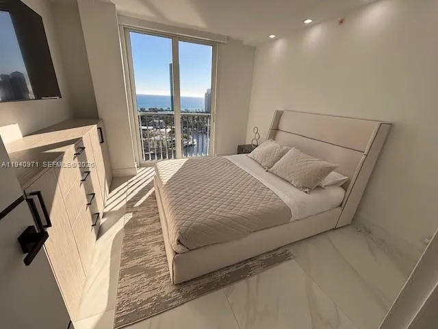 a bathroom with a bathtub a sink a toilet and a mirror