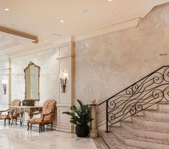 a swimming pool with outdoor seating and yard in the back