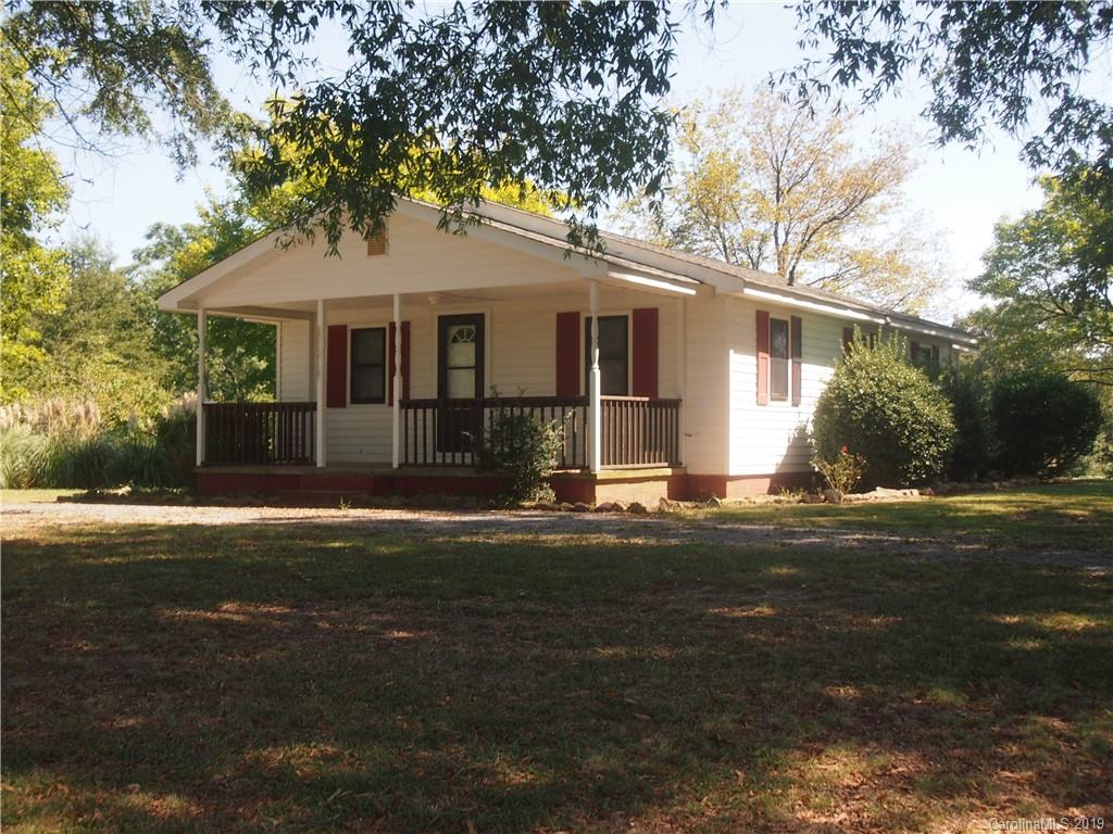2603 High Ridge Church Road Marshville, NC 28103 - Photo 1 of 16 a front view of a house with a garden