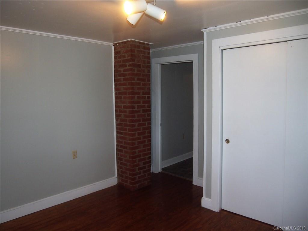 2603 High Ridge Church Road Marshville, NC 28103 - Photo 14 of 16 an empty room with wooden floor