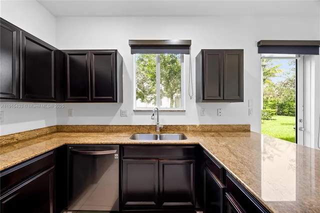 a kitchen with a sink and a window