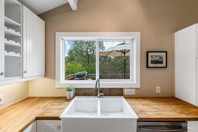 a kitchen with a sink and a window