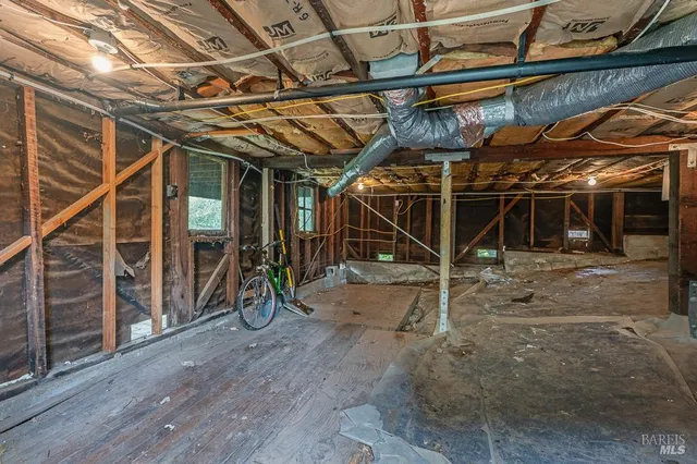 a view of a house with a tree front of house
