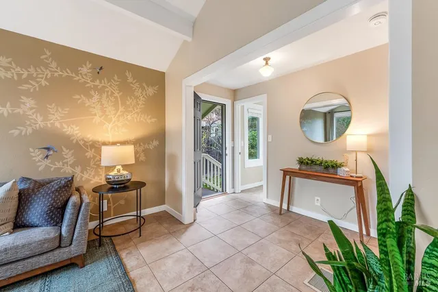 a view of a livingroom with furniture and front door