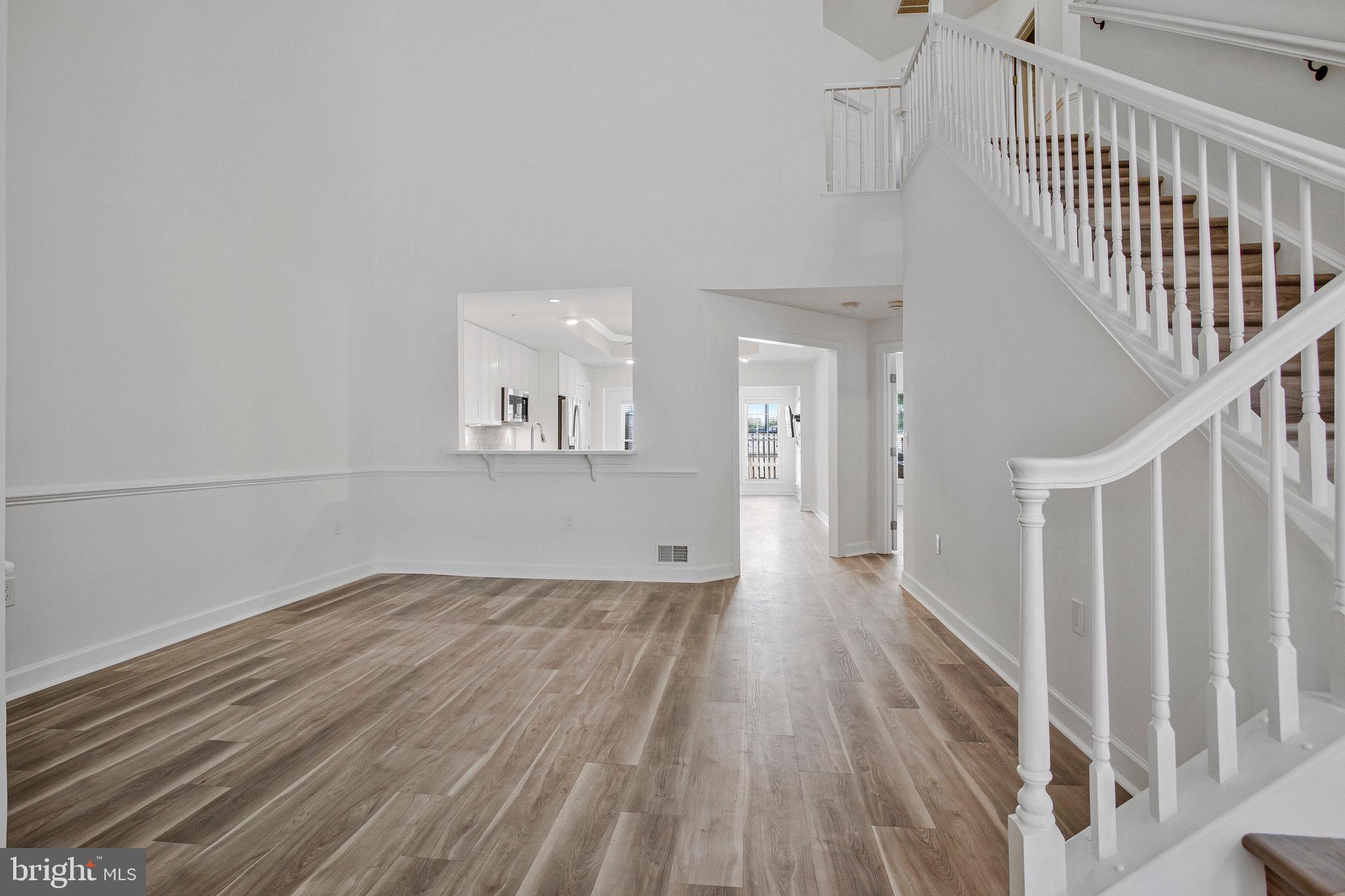 322 Hamlet Circle Edgewater, MD 21037 - Photo 6 of 21 a view of a hallway with wooden floor and entryway