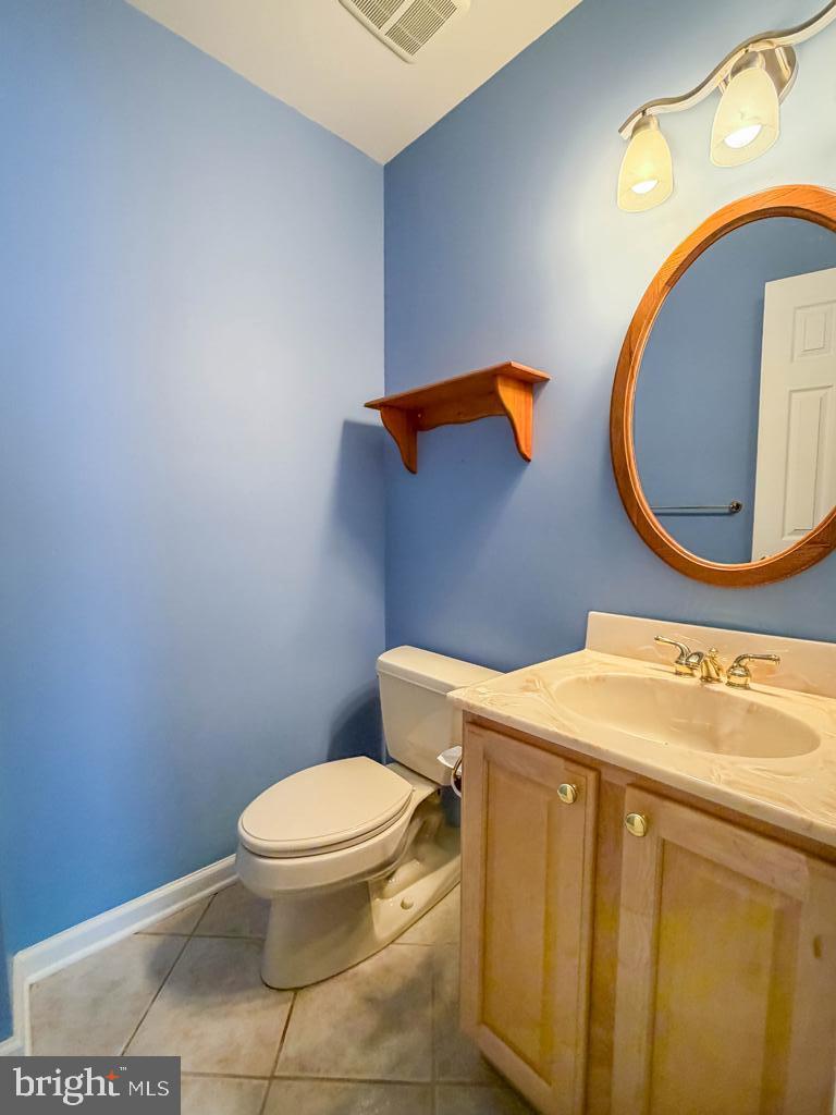 304 Barnsbury Road Langhorne, PA 19047 - Photo 19 of 55 a bathroom with a toilet sink vanity and mirror