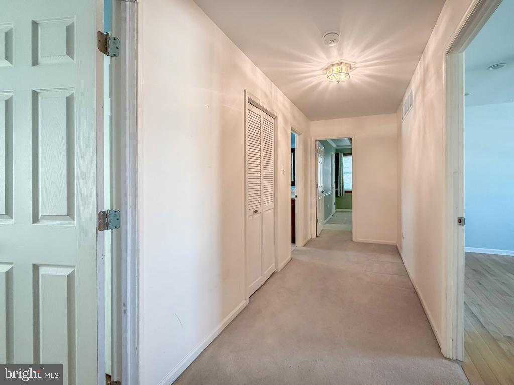 304 Barnsbury Road Langhorne, PA 19047 - Photo 20 of 55 a view of a hallway with a chandelier fan and closet