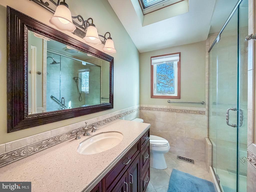 304 Barnsbury Road Langhorne, PA 19047 - Photo 29 of 55 a bathroom with a granite countertop double vanity sink a mirror and a toilet