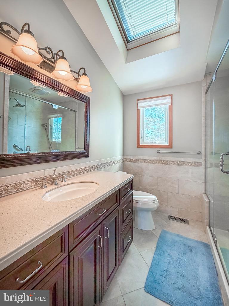 304 Barnsbury Road Langhorne, PA 19047 - Photo 30 of 55 a bathroom with a granite countertop sink a toilet and a mirror