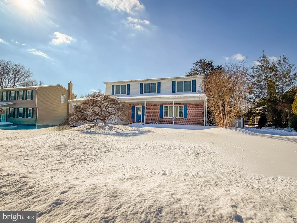 304 Barnsbury Road Langhorne, PA 19047 - Photo 3 of 55 a front view of a house with a yard covered in snow
