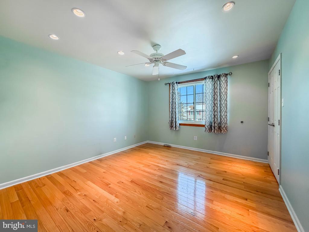 304 Barnsbury Road Langhorne, PA 19047 - Photo 31 of 55 wooden floor in an empty room with a window