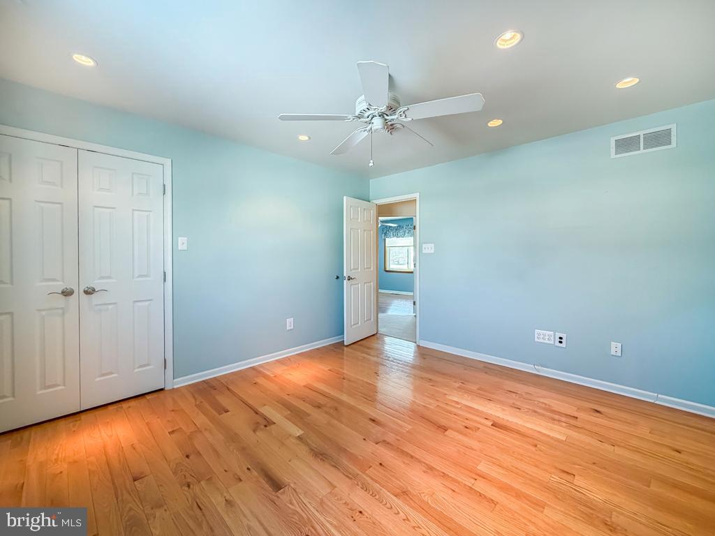 304 Barnsbury Road Langhorne, PA 19047 - Photo 32 of 55 an empty room with wooden floor closet and windows