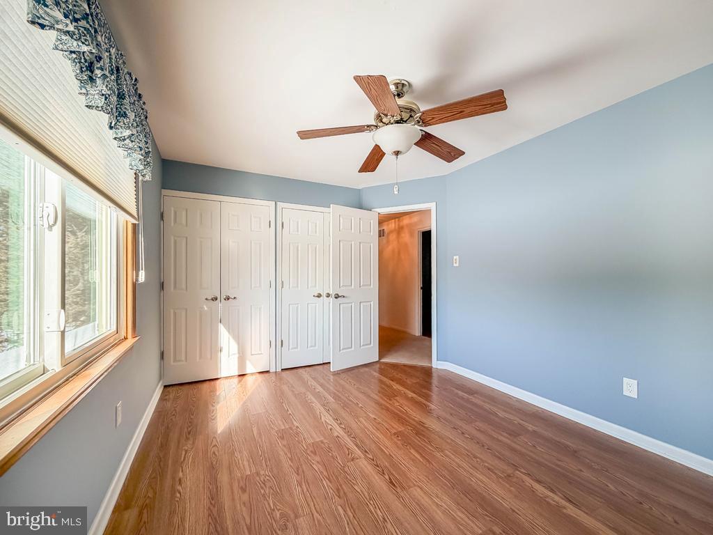 304 Barnsbury Road Langhorne, PA 19047 - Photo 34 of 55 a view of empty room with wooden floor and fan