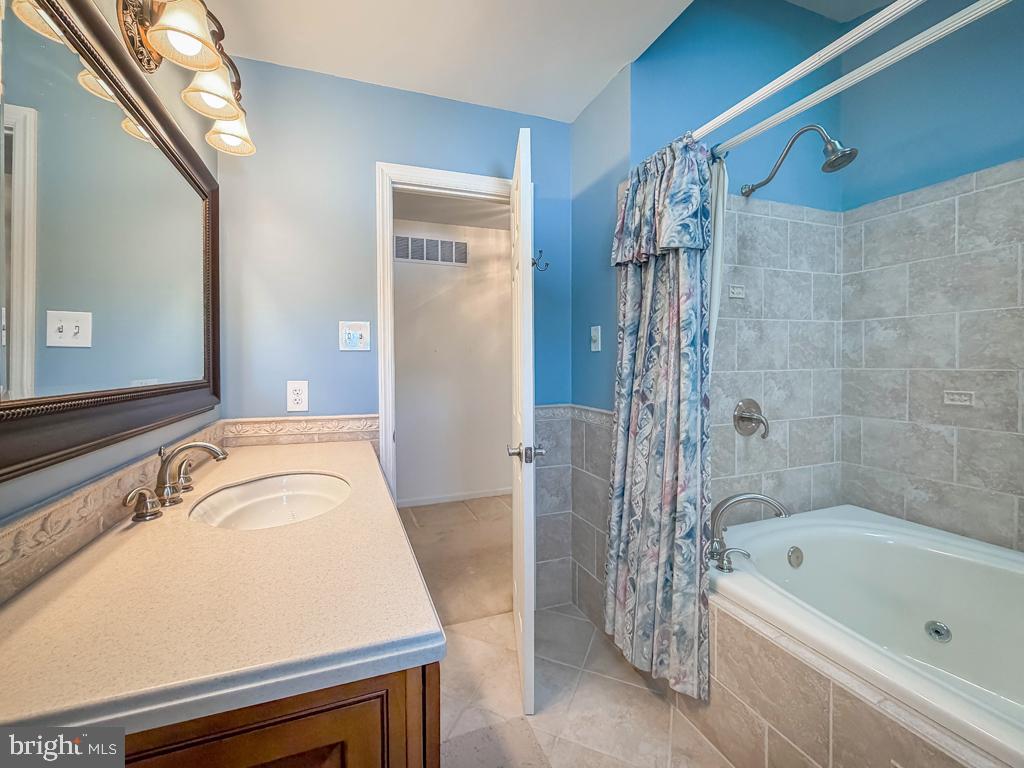 304 Barnsbury Road Langhorne, PA 19047 - Photo 38 of 55 a bathroom with a tub a sink and a shower