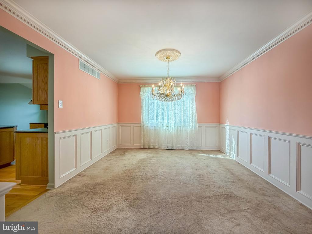 304 Barnsbury Road Langhorne, PA 19047 - Photo 9 of 55 a view of a livingroom with a chandelier