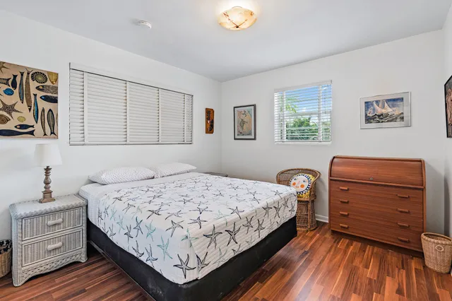 a bedroom with a bed and a dresser