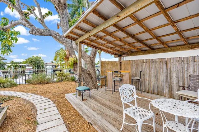 a view of a backyard with sitting area