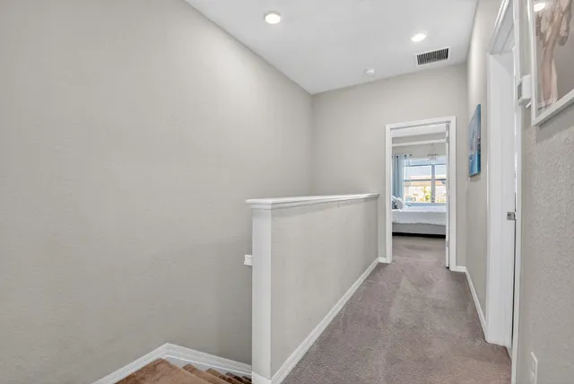 a bathroom with a sink a toilet and shower curtain
