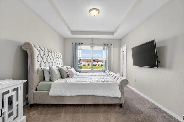 a bedroom with a bed and a mirror