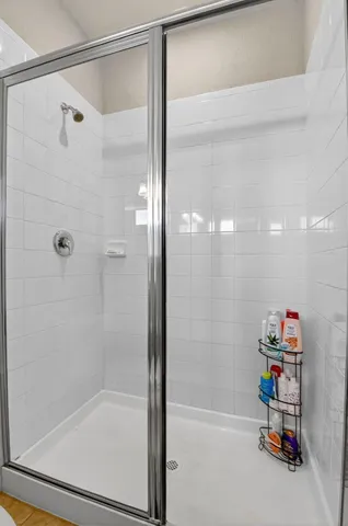 a bathroom with a sink mirror and vanity
