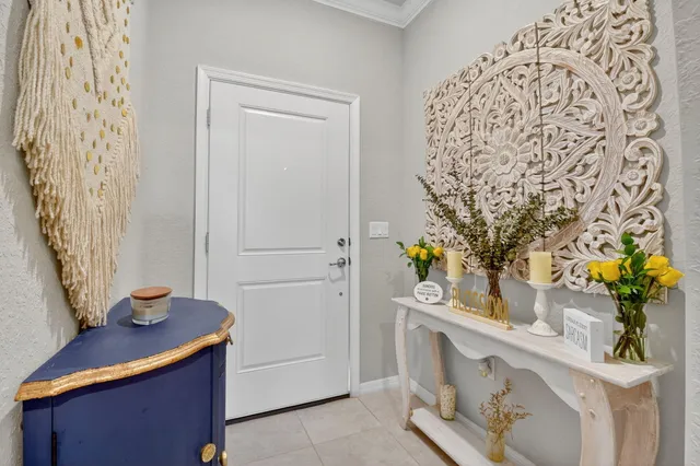 a kitchen with a sink and flowers