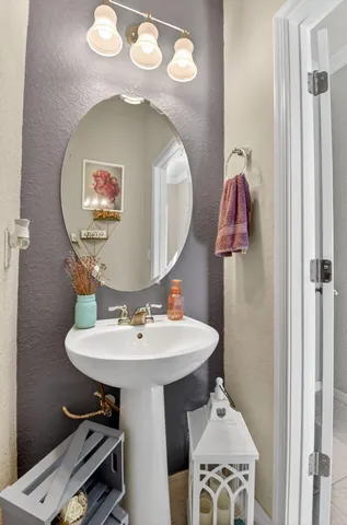 a view of a patio with a table and chairs