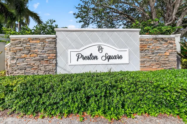 a view of a bench in back yard of a house