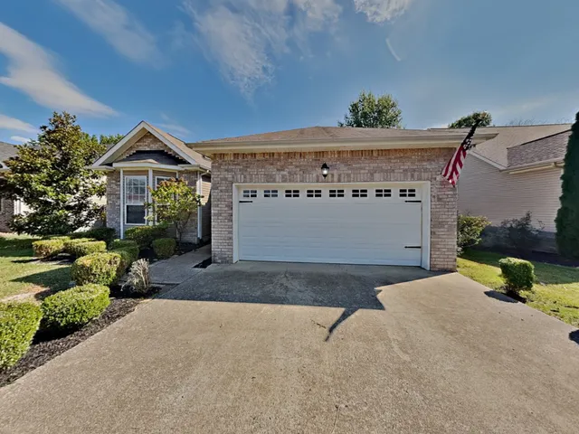 a view of a house with a garage