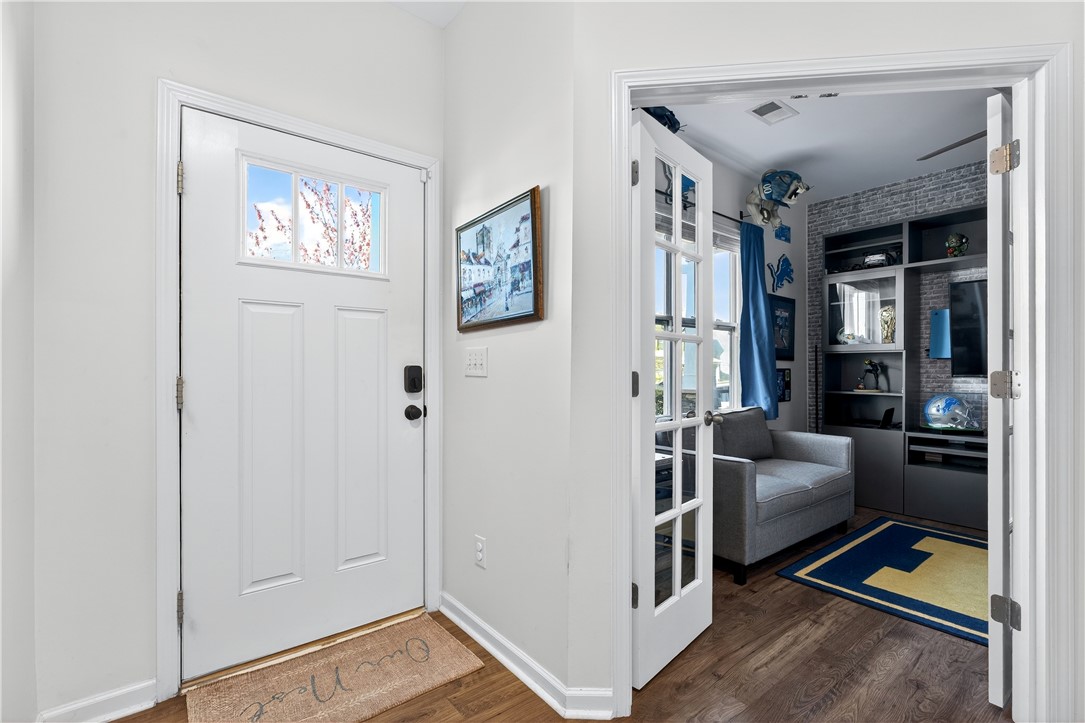 102 Preservation Drive Greer, SC 29650 - Photo 12 of 44 Step into this inviting entryway, featuring hardwood floors and elegant French doors leading to a cozy den.
