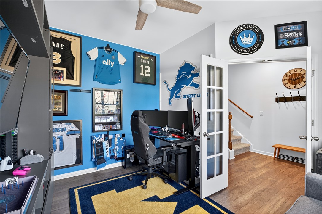 102 Preservation Drive Greer, SC 29650 - Photo 13 of 44 This versatile room features warm hardwood flooring, providing a comfortable and adaptable space.