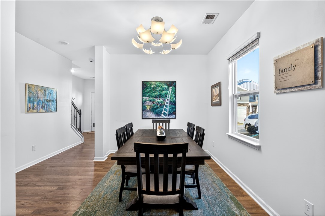 102 Preservation Drive Greer, SC 29650 - Photo 14 of 44 This dining room offers an inviting atmosphere for meals and gatherings with its appealing design.