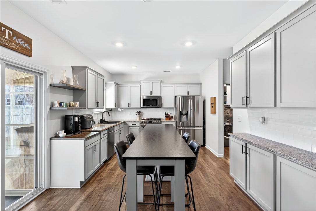 102 Preservation Drive Greer, SC 29650 - Photo 2 of 44 This kitchen features sleek countertops and modern appliances, perfect for everyday living.