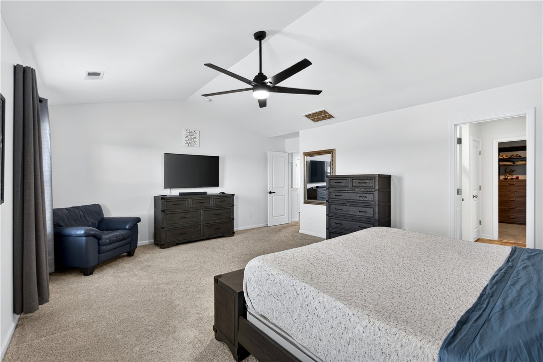 102 Preservation Drive Greer, SC 29650 - Photo 25 of 44 This spacious bedroom offers comfortable carpeting and a ceiling fan for optimal comfort.