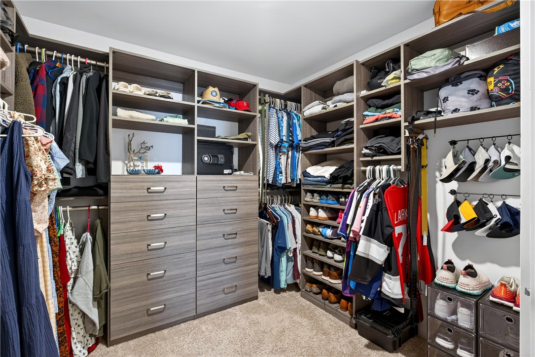 102 Preservation Drive Greer, SC 29650 - Photo 29 of 44 This spacious walk-in closet features extensive built-in storage, keeping everything organized and easily accessible.