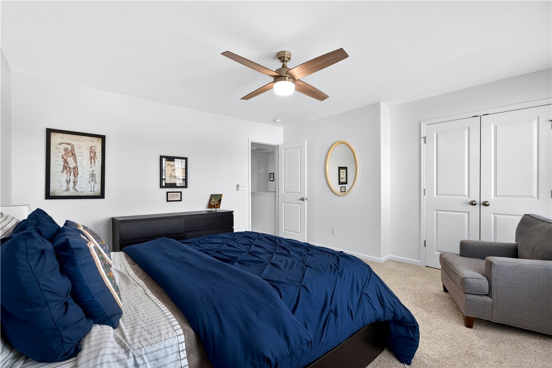 102 Preservation Drive Greer, SC 29650 - Photo 31 of 44 This spacious bedroom offers comfort and modern amenities, ideal for unwinding after a long day.