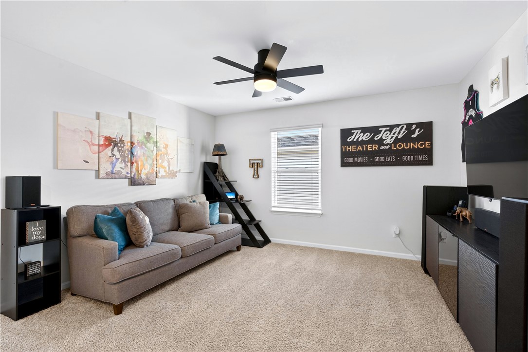 102 Preservation Drive Greer, SC 29650 - Photo 32 of 44 This versatile room offers comfort and functionality for various activities.