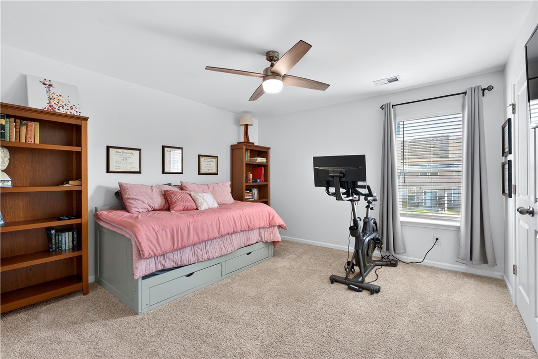 102 Preservation Drive Greer, SC 29650 - Photo 34 of 44 This cozy bedroom offers a tranquil retreat with soft carpet and ample natural light.