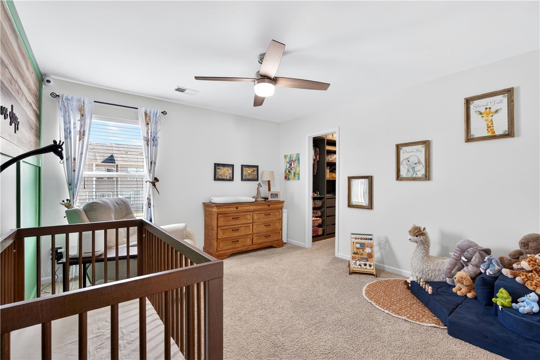 102 Preservation Drive Greer, SC 29650 - Photo 35 of 44 This light-filled bedroom features soft carpeting and ample storage options.